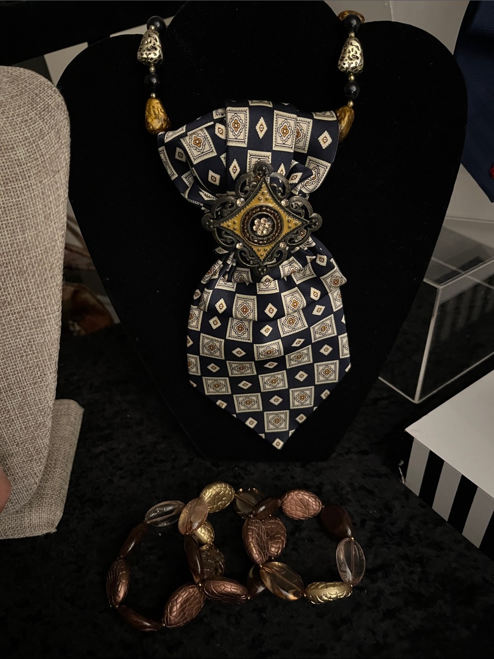 Gold and Copper Neckwear with Medallion Accent, and Bracelets